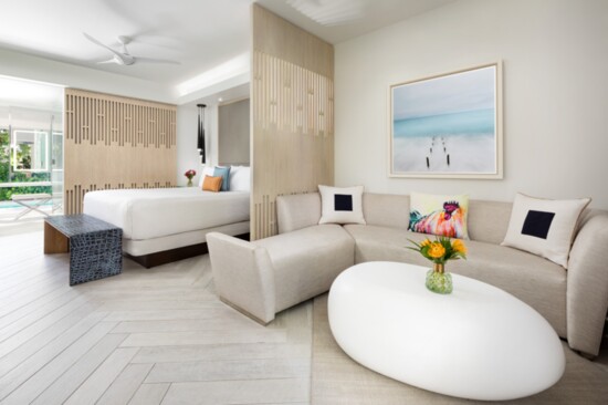 Plush furnishings and tasteful coastal-themed artwork add a touch of sophistication
