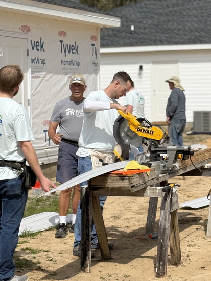 Volunteers and board members give their time and talent at build days for Habitat homes. 