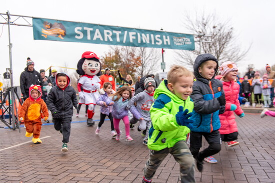 Rosie Red hypes the Kids' Fun Run participants.