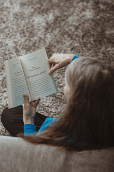 Author Ellen Seigel reads a passage from her book, "Be Happy No Matter What."