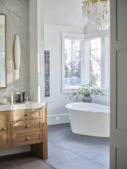 Separate vanity and asymmetric tub.