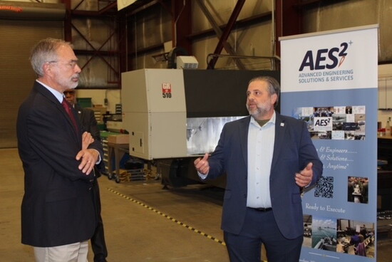 Mike Watts with community leaders. Photo courtesy of AES2. 