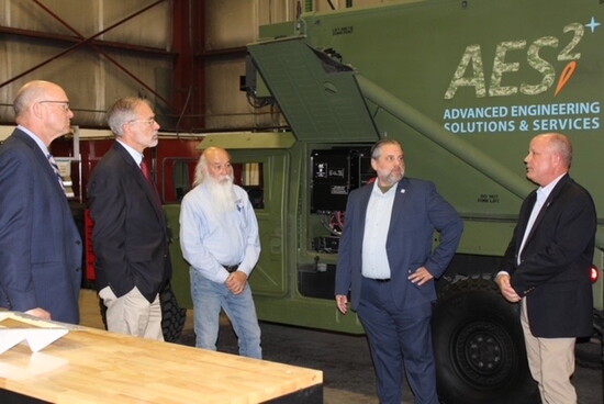 Mike Watts with community leaders. Photo courtesy of AES2. 