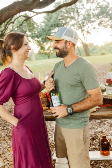 Jordan Anderson, partner at FullTilt Landscapes LLC, and his wife Angela enjoy their wine selection from Cork and Cap