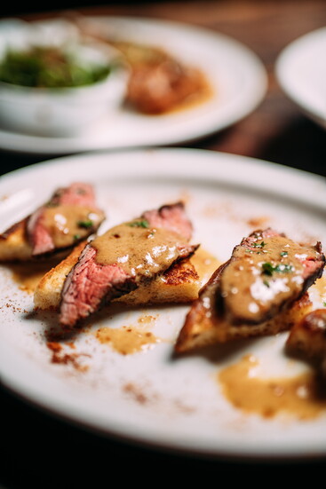 Glass Hollow Table & Tavern Whiskey Triangles Sliced Steak, Whiskey Cream Sauce made with Jack Daniels Tennessee Honey