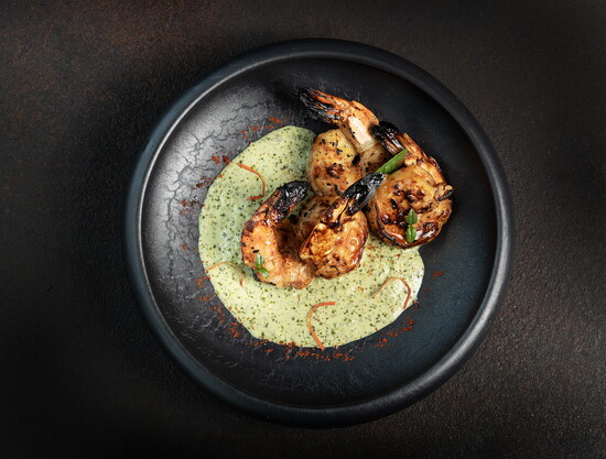 Marinated, grilled jumbo wild shrimp with bhoomi herb sauce (credit: Simi Jois)