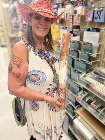 Janet shopping for supplies for a new creation.