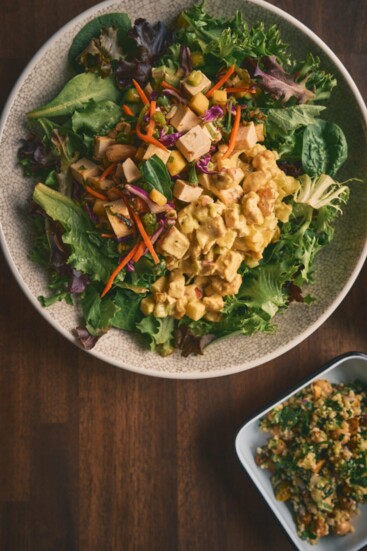 Chop'd Salad Bowl With Curry Chicken and Thai Mango Tofu, and a side of Kale Caesar at True Food Kitchen