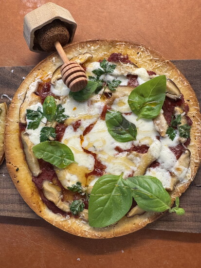 Cheese Pizza with hot honey, caramelized onion and basil