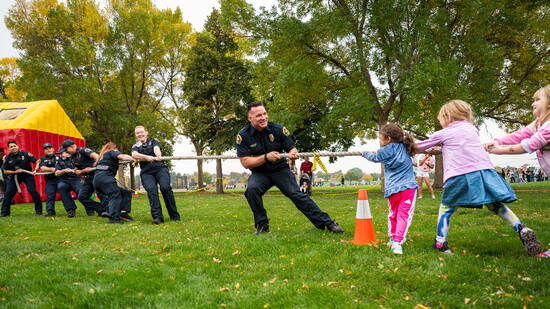 Kids take on Greeley Firefighters and UCHealth Paramedics in the annual “Kids vs. Firefighters” tug-of-war at the Station 5 Open House, October 2025