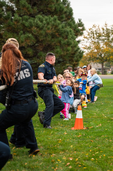 Kids take on Greeley Firefighters and UCHealth Paramedics in the annual “Kids vs. Firefighters” tug-of-war at the Station 5 Open House, October 2025