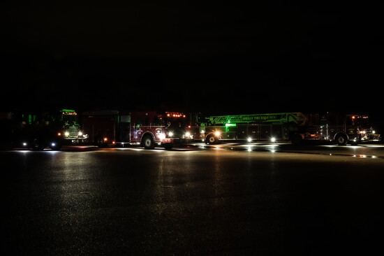 Greeley fire apparatus staged and awaiting dispatch during a nighttime live burn training scenario