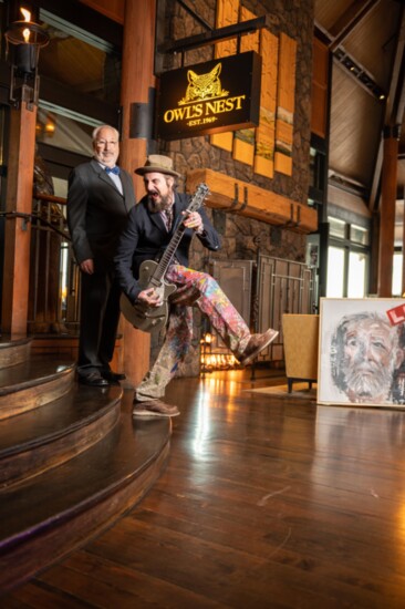 Artist, actor and musician Nicola Carpinelli grabs his guitar for some fun at Sunriver Resort with his HUE co-founder, Dr. Howard Asher, Psy.D. 