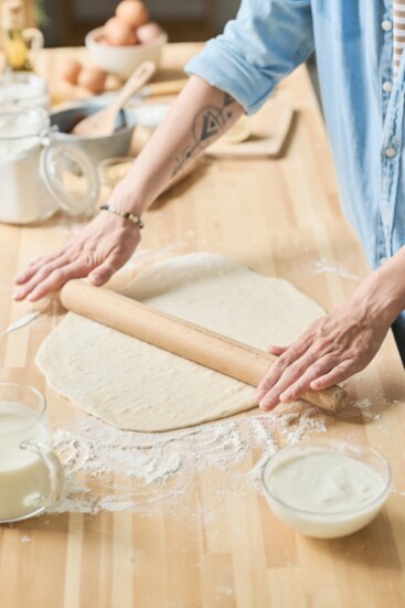 Rolling out the dough.