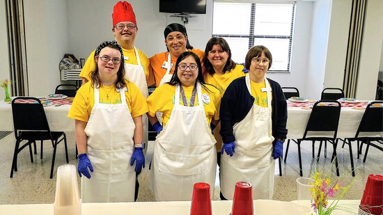 A group of Hearty Kitchen Academy workers and instructors