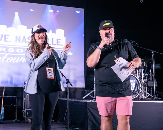 Y'all 106.7 radio personality Taylor Stanford shares the stage with emcee Andy Gilley.
