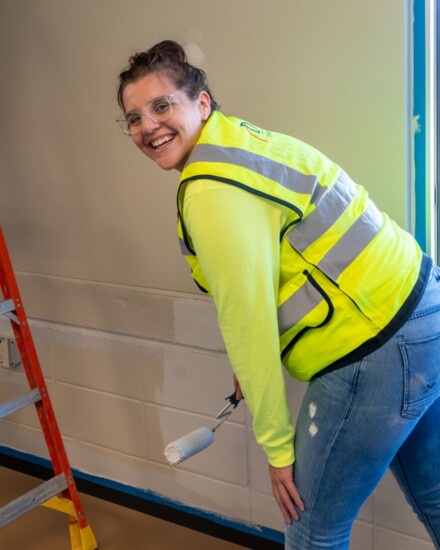 A volunteer painter enjoys her day at the Shalom Zone.