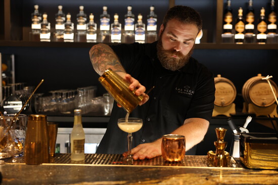 Cody Fredrickson pouring a signature cocktails