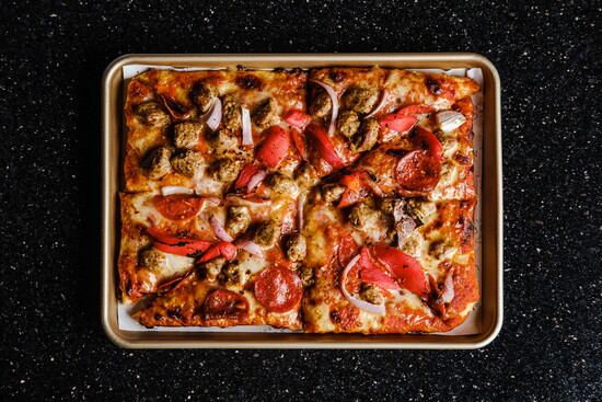 Flavorful Ann-Margret “Supreme” pizza 