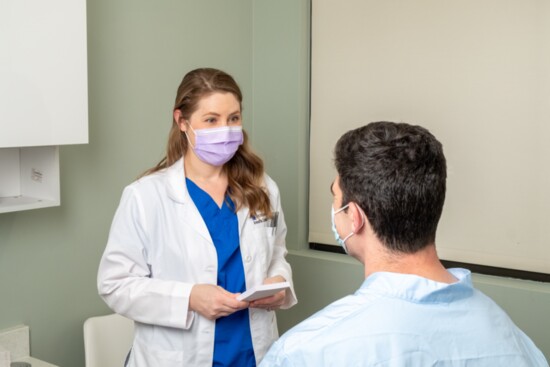 With a patient. (Photo: Michael Graham)