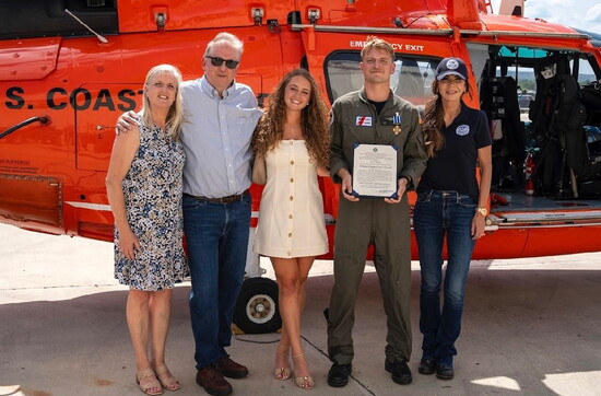 Scott with his family and Secretary of Homeland Security Kristi Noem