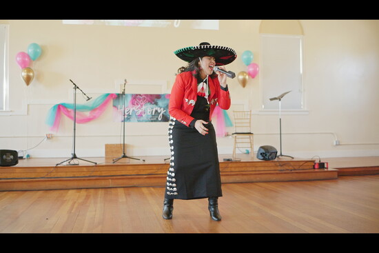 Azanet Rodriguez is singing mariachi music at our HerStory reception