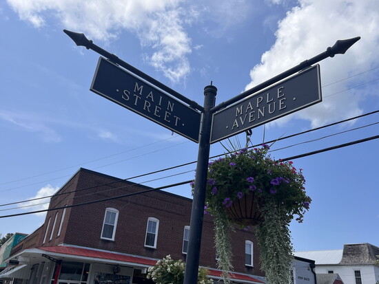 Street sign at the intersection of Main Street and Maple Avenue. Photo Credit: Kat Larkin.