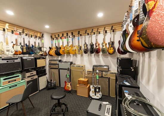 Electric demo room for trying out guitars and amps. An acoustic demo room is separate.
