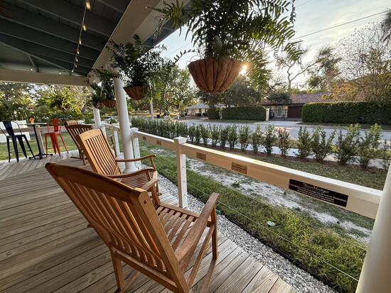 A wraparound porch with comfy rockers harken to times past, at Lord-Higel’s Coffee House. (Photo courtesy the City of Venice)