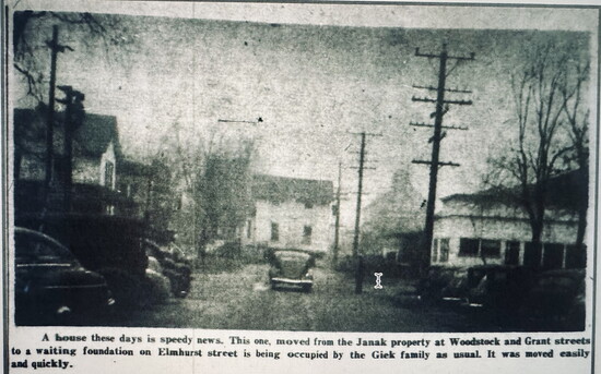 Newspaper clipping of 115 Elmhurst St. being moved down Woodstock St. Photo provided by Crystal Lake Historical Society