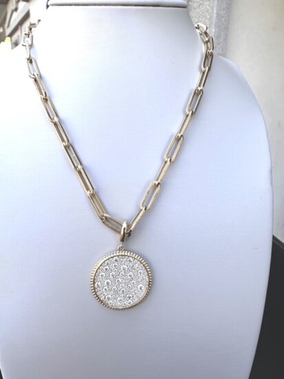 For Her: A 14K yellow gold Gabriel & Co. diamond Pave Bujukan 24 MM Medallion pendant with a total diamond weight of 2 carats. You can choose the chain length.