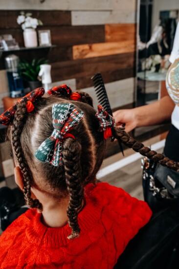 Leave the braids dangling for younger girls.