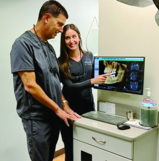 TOP: Drs. Spennato discuss a CBCT X-Ray