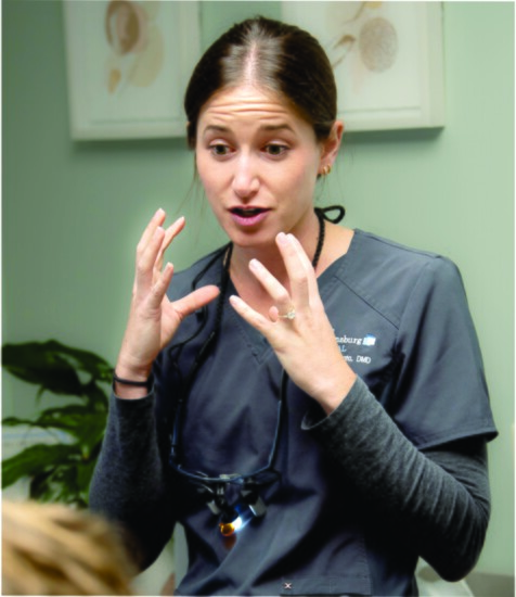 RIGHT: Dr. Alexa consults with a patient