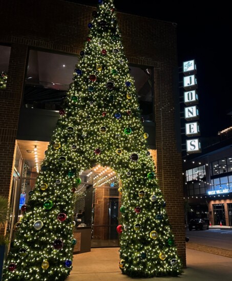 An ornament-laden Christmas tree offers a sampling of the festive holiday decor to be found inside.