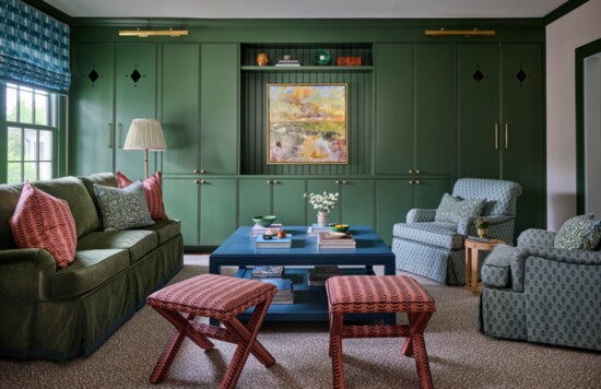 Benjamin Moore’s Sweet Basil makes a bold statement on the family room cabinet. The sofa’s lush velvet upholstery is a performance fabric Materialworks.