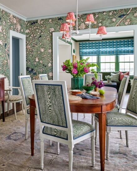 A mélange of colors and prints room creates a stunning setting. Wallpaper is Les Oiseaux by Schumacher and chair fabric is Wood by Brunschwig & Fils. 