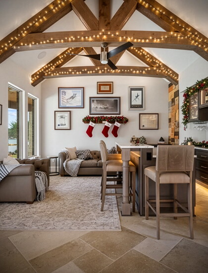 Soft lighting and natural wood beams bring warmth to a holiday-ready living space, where modern comfort meets classic Story Built craftsmanship.