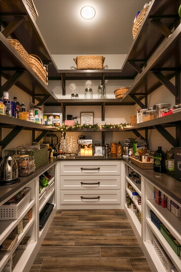 A well-organized pantry becomes a hidden holiday retreat, complete with twinkling lights and a cozy coffee corner ready for winter mornings.