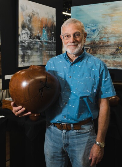 Artisan woodturner Larry Zarra with a mesquite piece