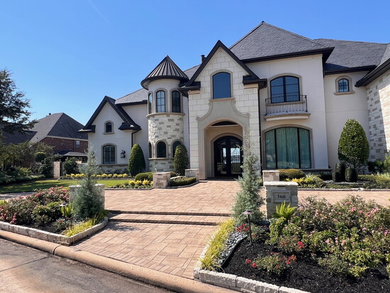 Curb appeal w/landscaping and custom driveway