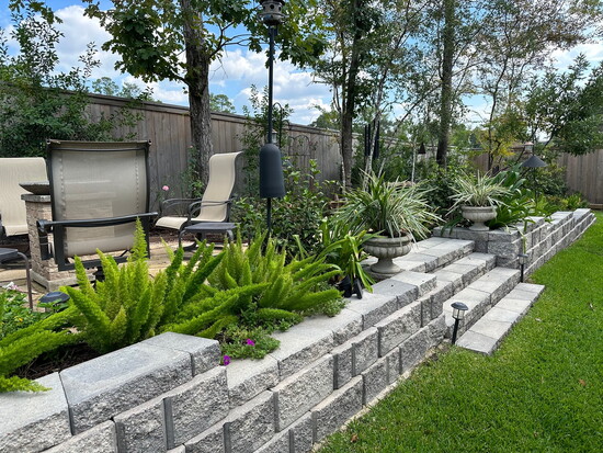Elevated patio area landscaped well