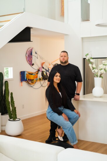 Jim and Mari Robertson with artwork by Rachel Eulena Williams. 