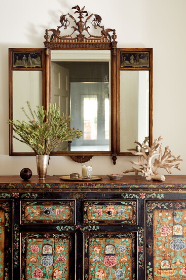 Ebert mixed family history with L.A. style, pairing a three-piece heirloom mirror with an antique floral chest by Dan Marty Design