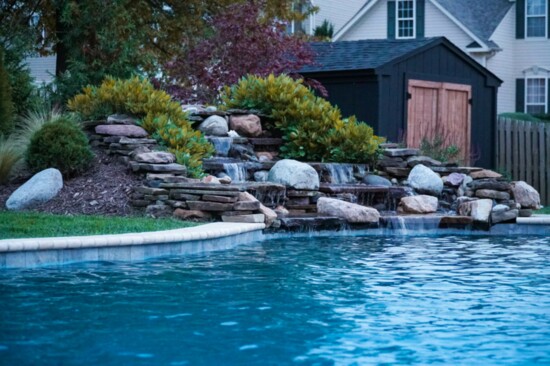 Steve Braun, owner of Backyard Creations, said the company is known for incorporating high-end features like this waterfall, into the pools they build. 