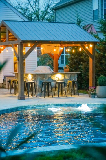 Bubblers and lights enhance the enjoyment and beauty of this oasis, built by Backyard Creations. 