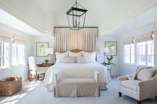 Layering baskets, decorative pillows and Matouk bedding gives a finished look to this sumptuous bedroom.