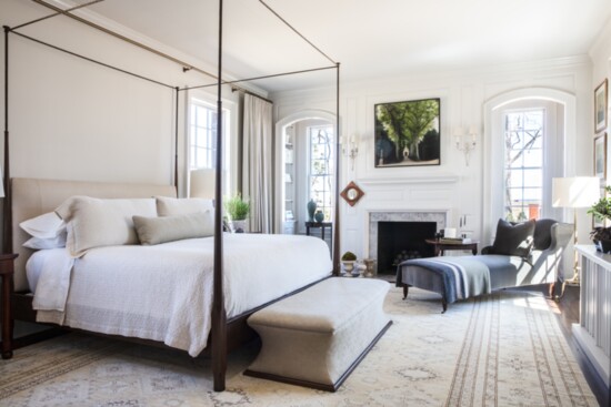 A fabulous Rose Tarlow bed is the focal point in this inviting bedroom.