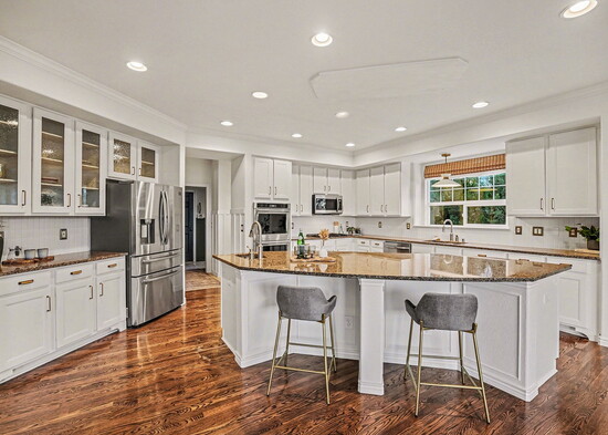 The kitchen provides ample space for daily use and entertaining.