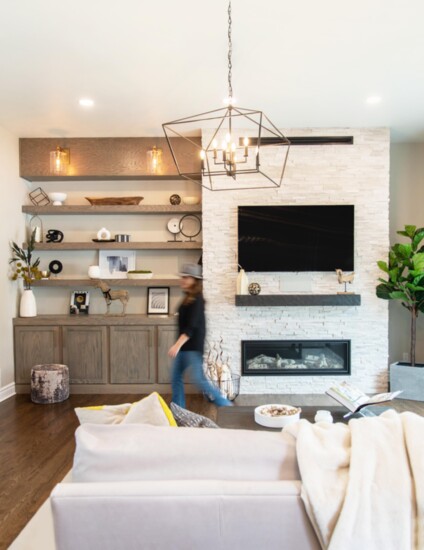 A redesigned fireplace and custom built-in adds warmth to this common area.